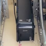 Modern smart garage door opener system in a stylish suburban home, controlled via smartphone.